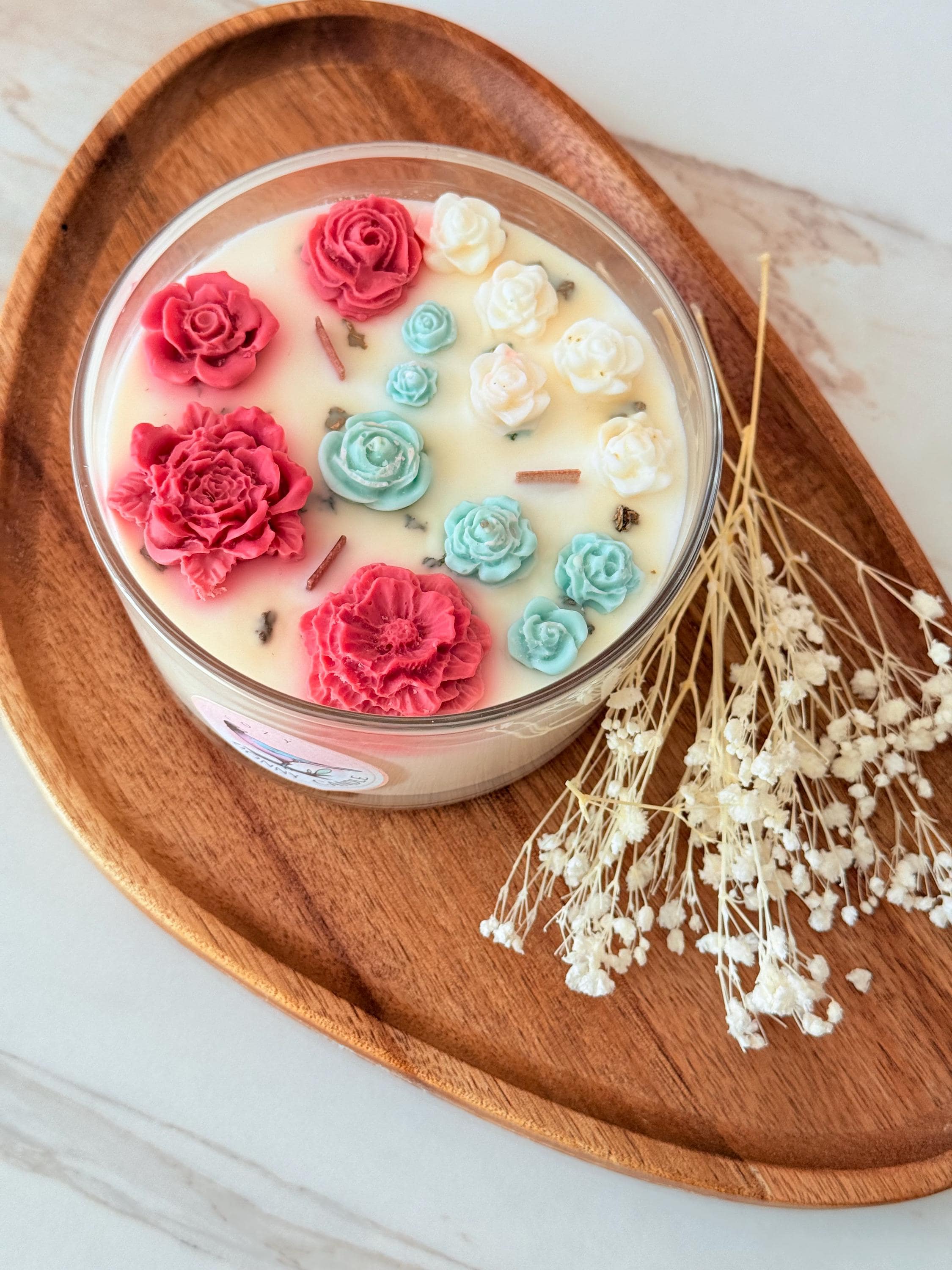 Handmade soy wax candle with wooden wick in a warm vanilla and sandalwood blend. Eco-friendly, vegan, and long-burning, this natural scented candle fills any room with a cozy, relaxing fragrance. The crackling wooden wick creates a calming atmosphere, perfect for home décor, self-care rituals, or thoughtful gifts. Packaged in a reusable jar, this toxin-free candle makes a luxury gift for him, her, or any occasion.